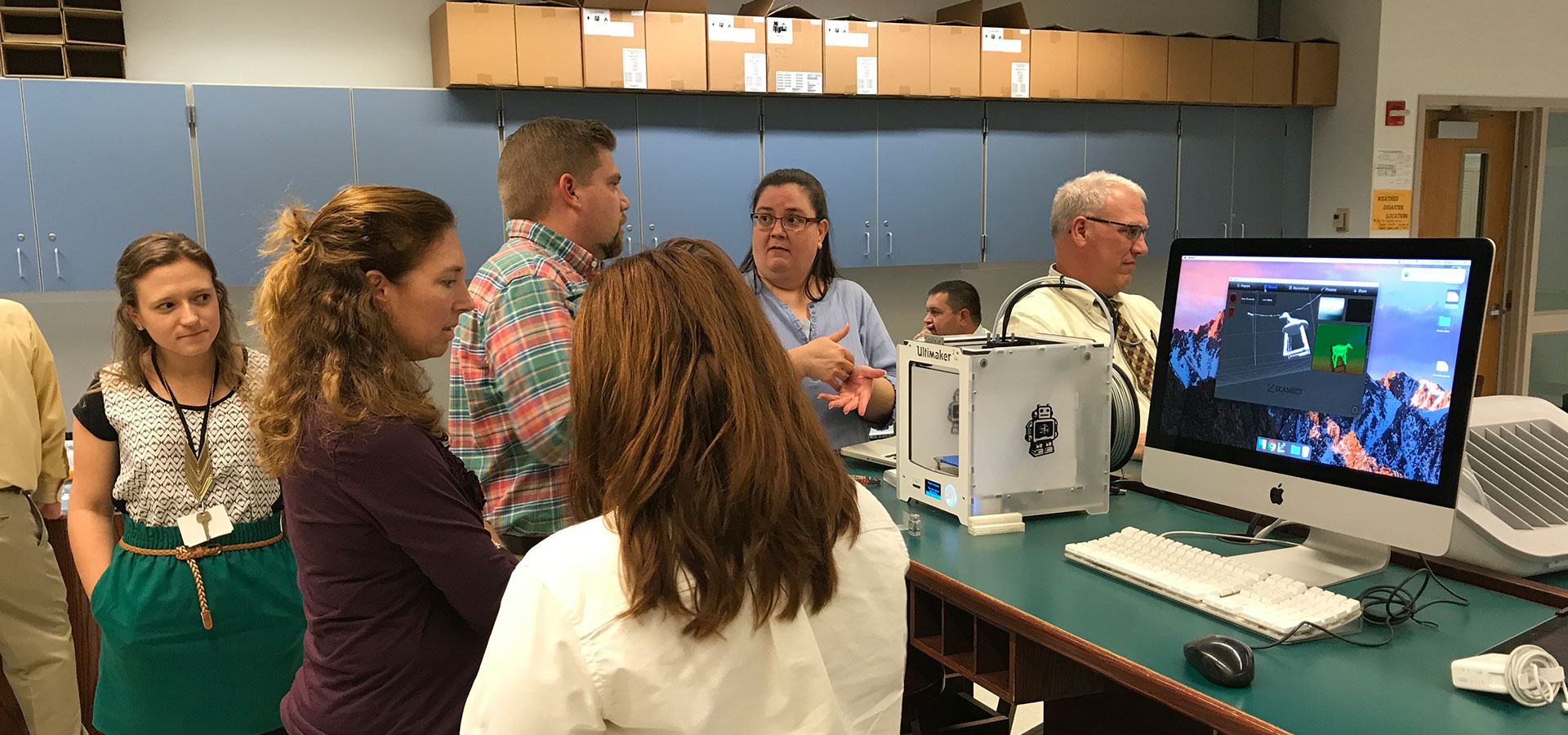 students and teachers in maker lab
